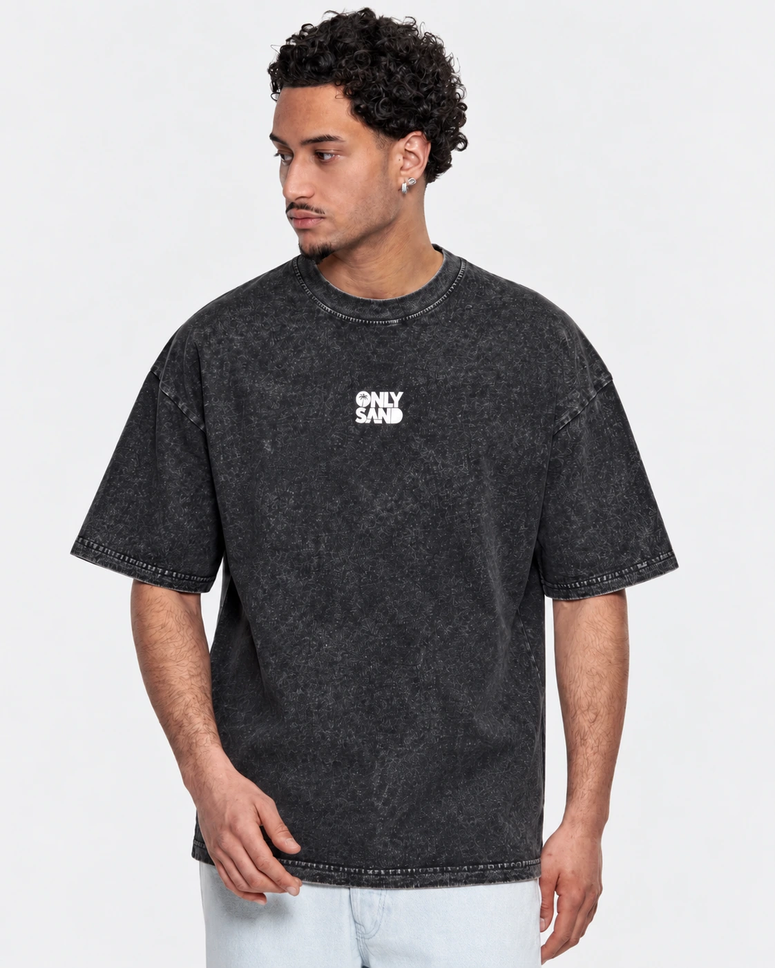 Front view of the GRAVITY washed charcoal-black T-shirt with a small white ONLY SAND logo.